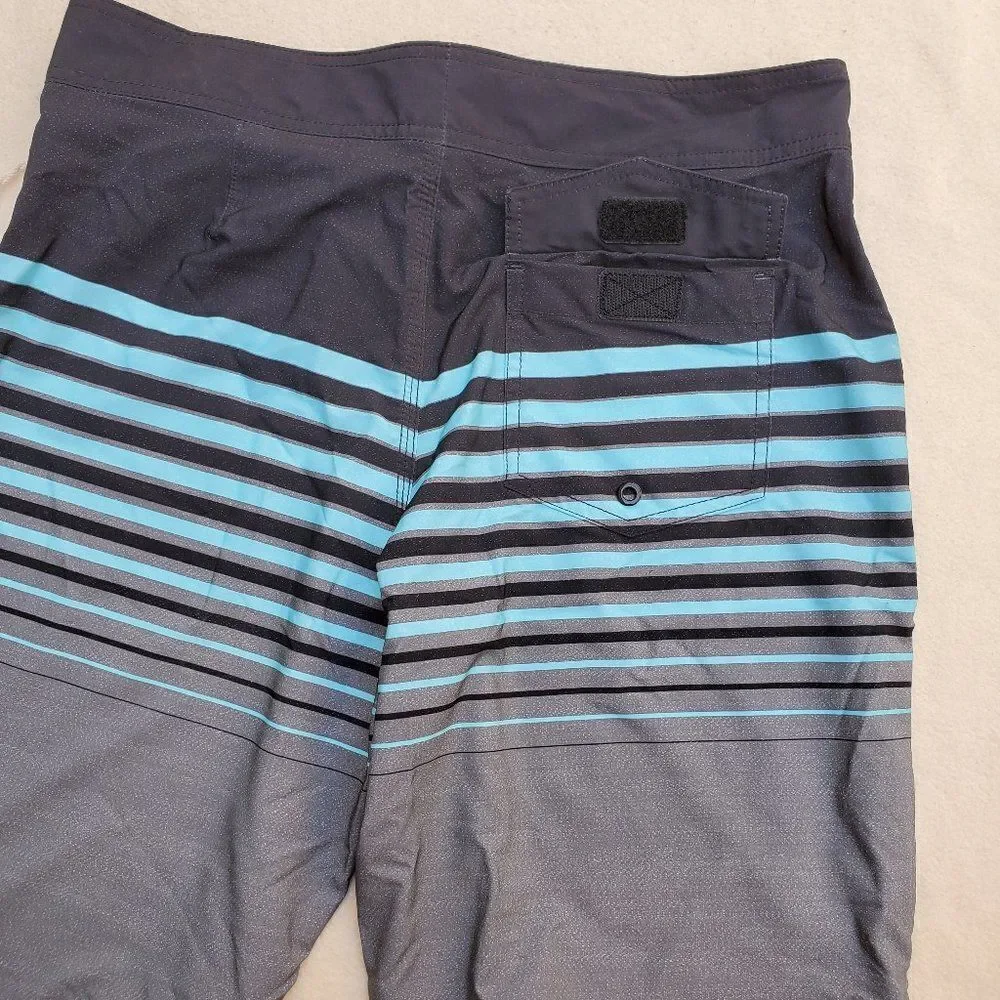 Mossimo black, teal, and gray striped board shorts